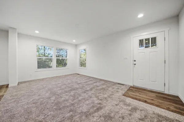a view of an empty room with a window