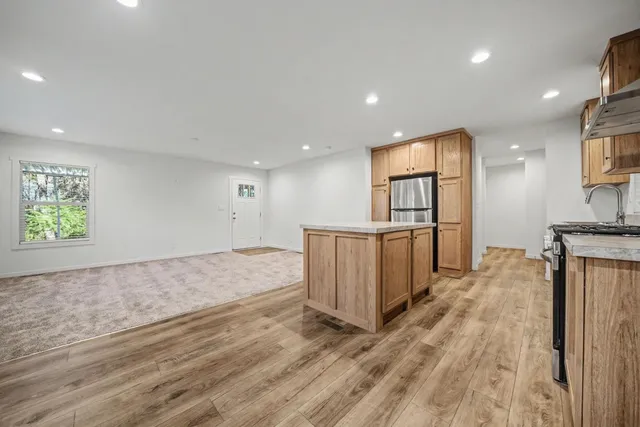 a view of kitchen with furniture and wooden floor