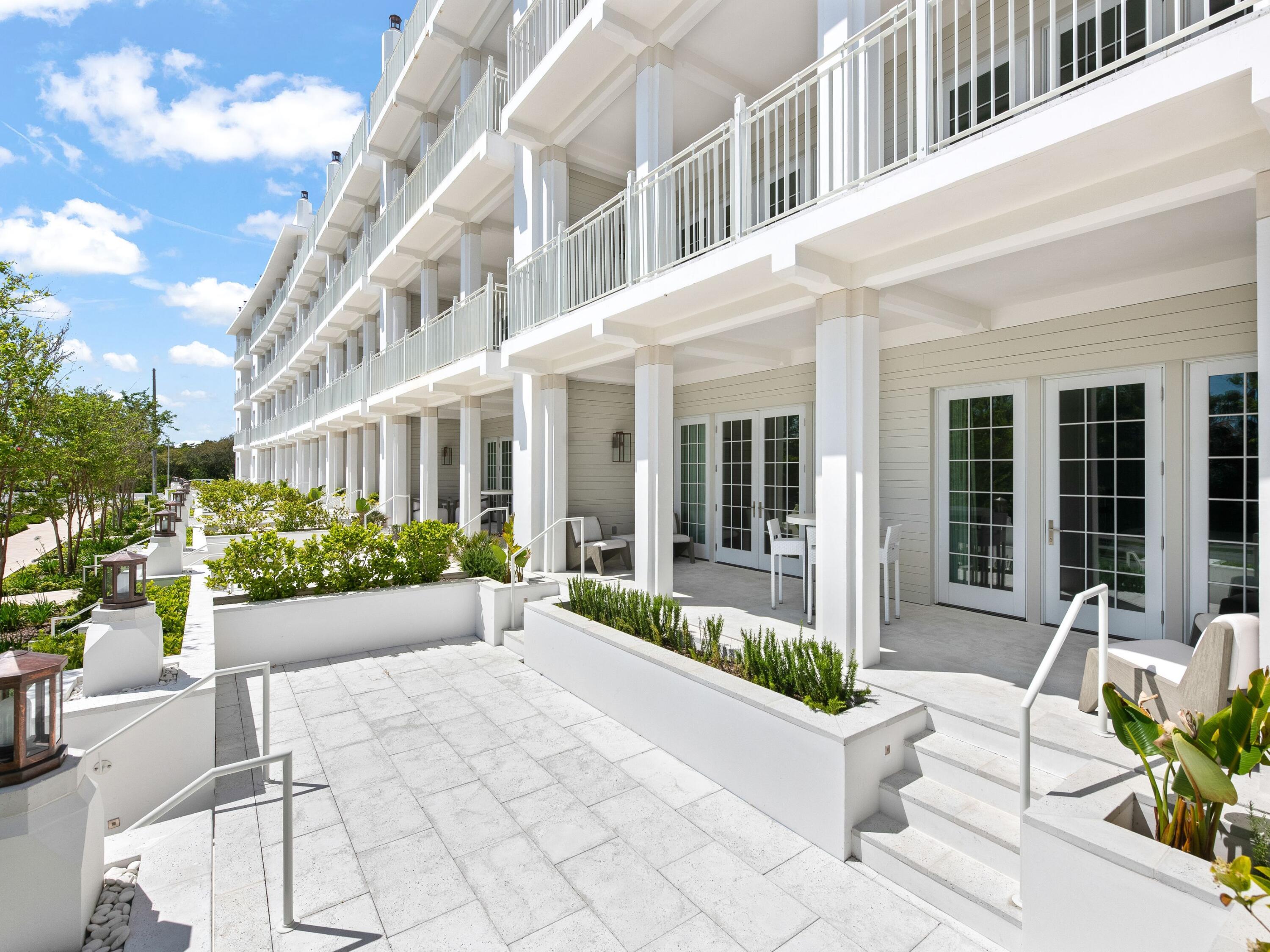 45 West Solaire Way Inlet Beach, Unit 103 Inlet Beach, FL 32461 - Photo 22 of 25 a view of a building with sitting area