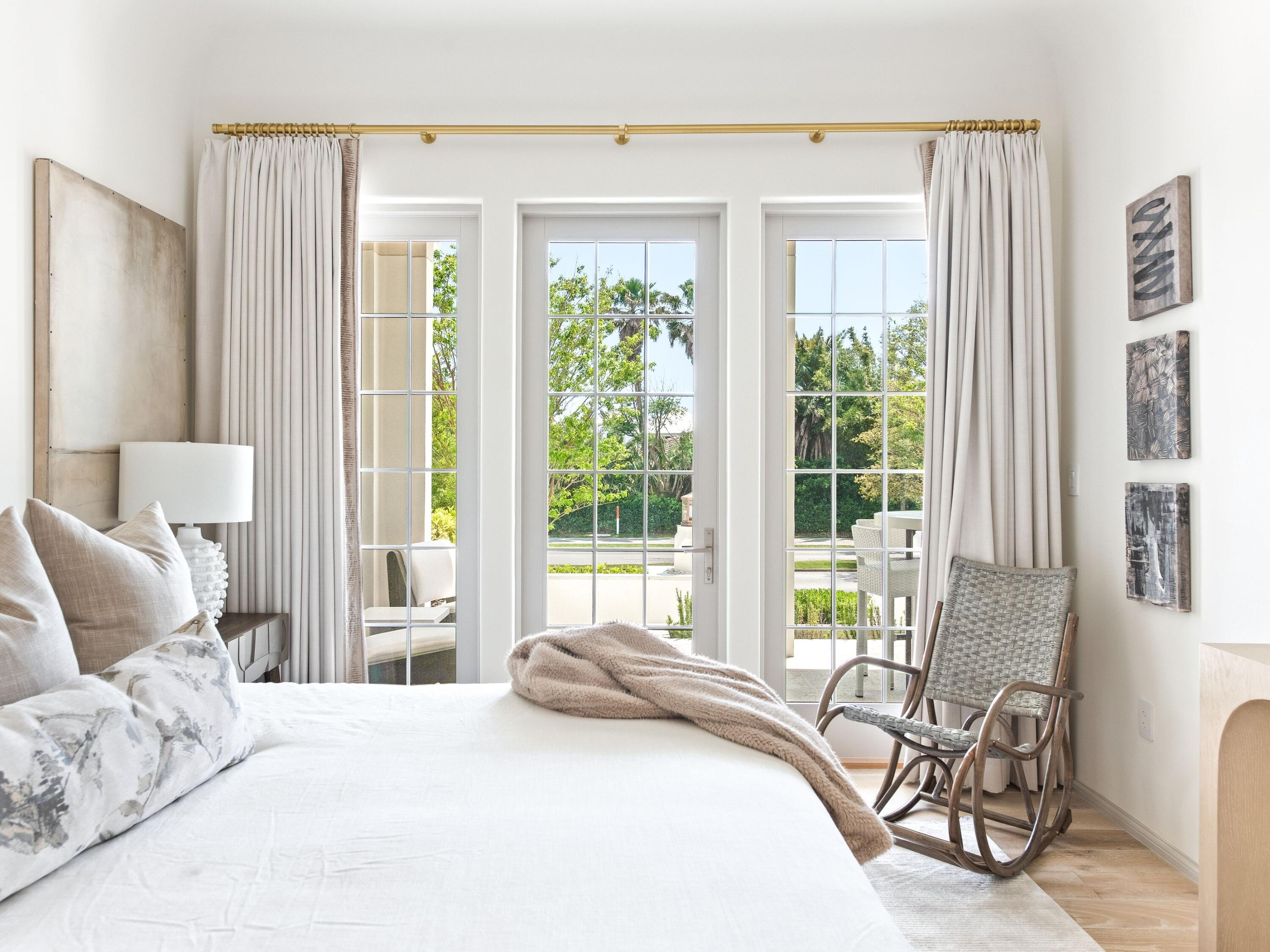 45 West Solaire Way Inlet Beach, Unit 103 Inlet Beach, FL 32461 - Photo 3 of 25 a bedroom with a bed and large windows