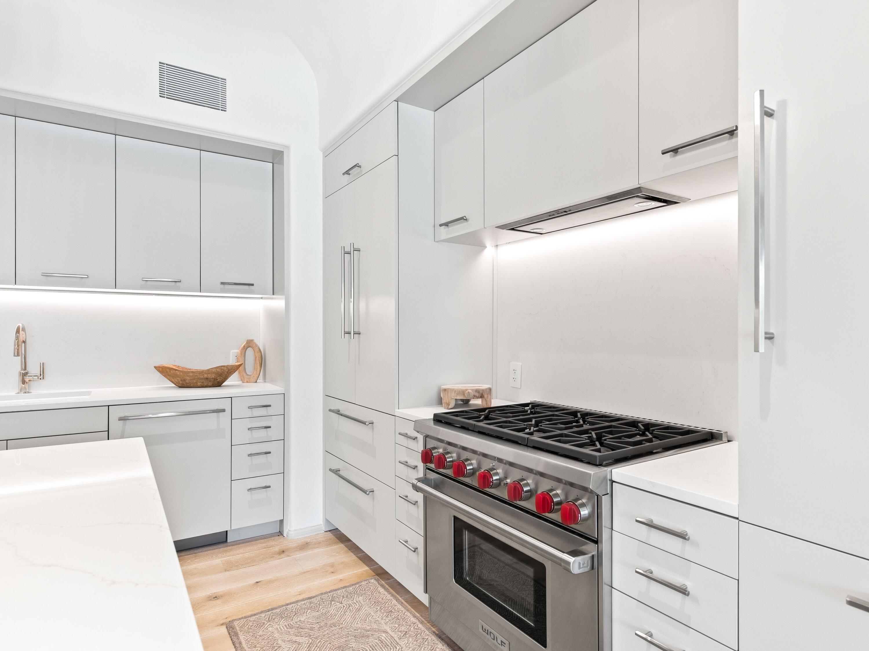 45 West Solaire Way Inlet Beach, Unit 103 Inlet Beach, FL 32461 - Photo 10 of 25 a kitchen with cabinets and appliances