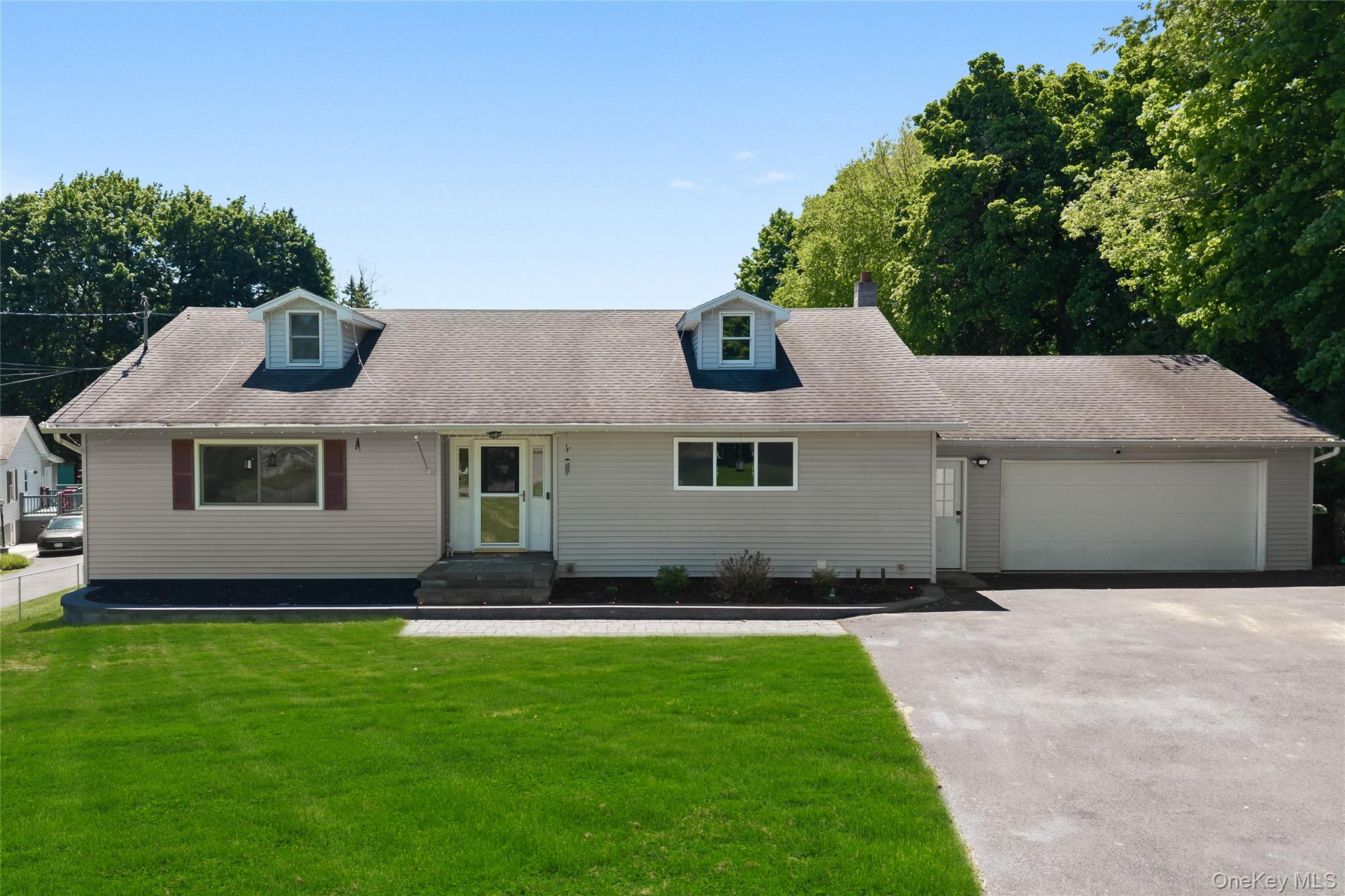 69 Silver Spring Road New Windsor, NY 12553 - Photo 1 of 20 a front view of a house with a garden