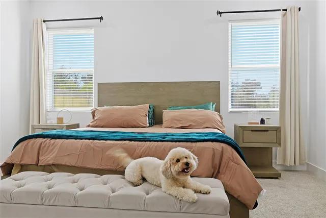 a bedroom with a bed and window