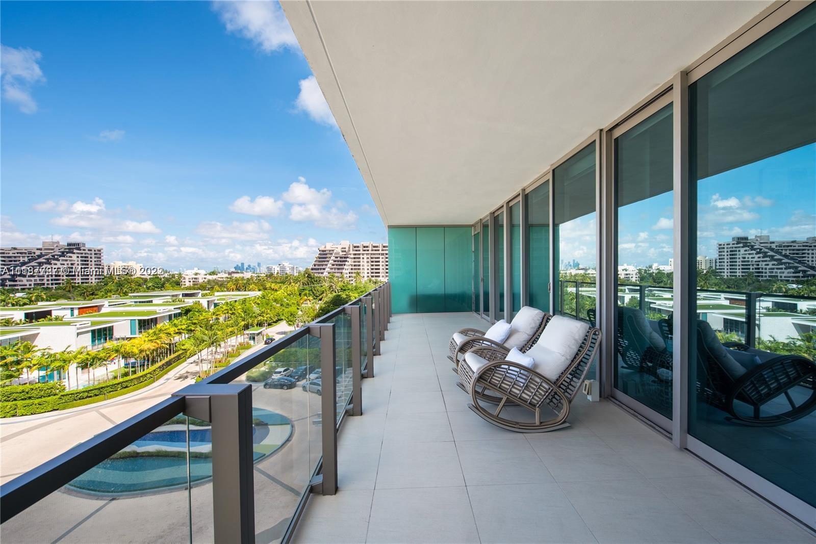 360 Ocean Drive, Unit 603S Key Biscayne, FL 33149 - Photo 11 of 29 a balcony with furniture and city view