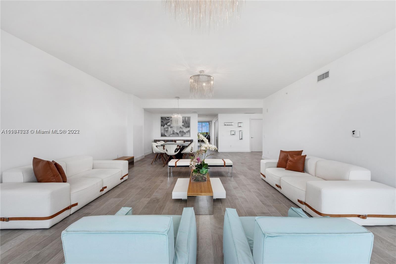 360 Ocean Drive, Unit 603S Key Biscayne, FL 33149 - Photo 14 of 29 a living room with furniture and a rug