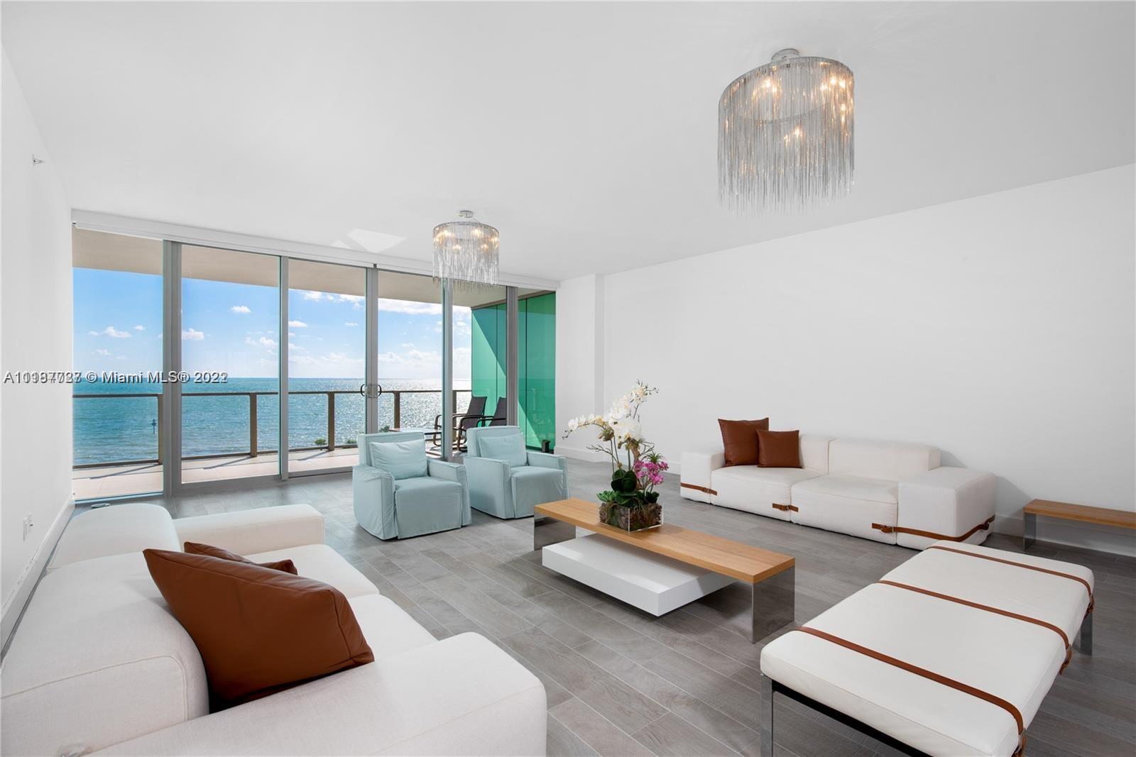 360 Ocean Drive, Unit 603S Key Biscayne, FL 33149 - Photo 26 of 29 a living room with furniture and a large window