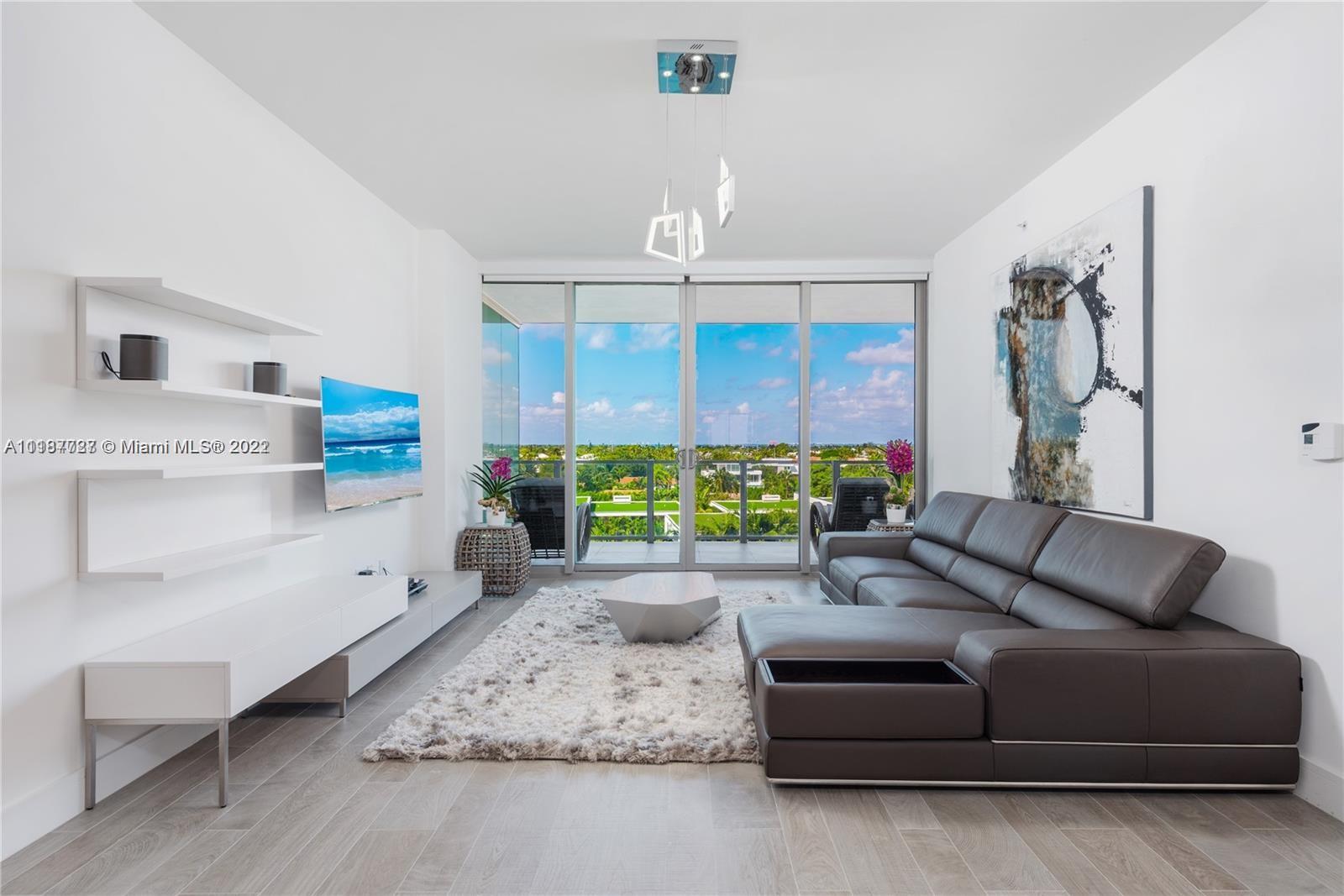 360 Ocean Drive, Unit 603S Key Biscayne, FL 33149 - Photo 7 of 29 a living room with furniture and a chandelier