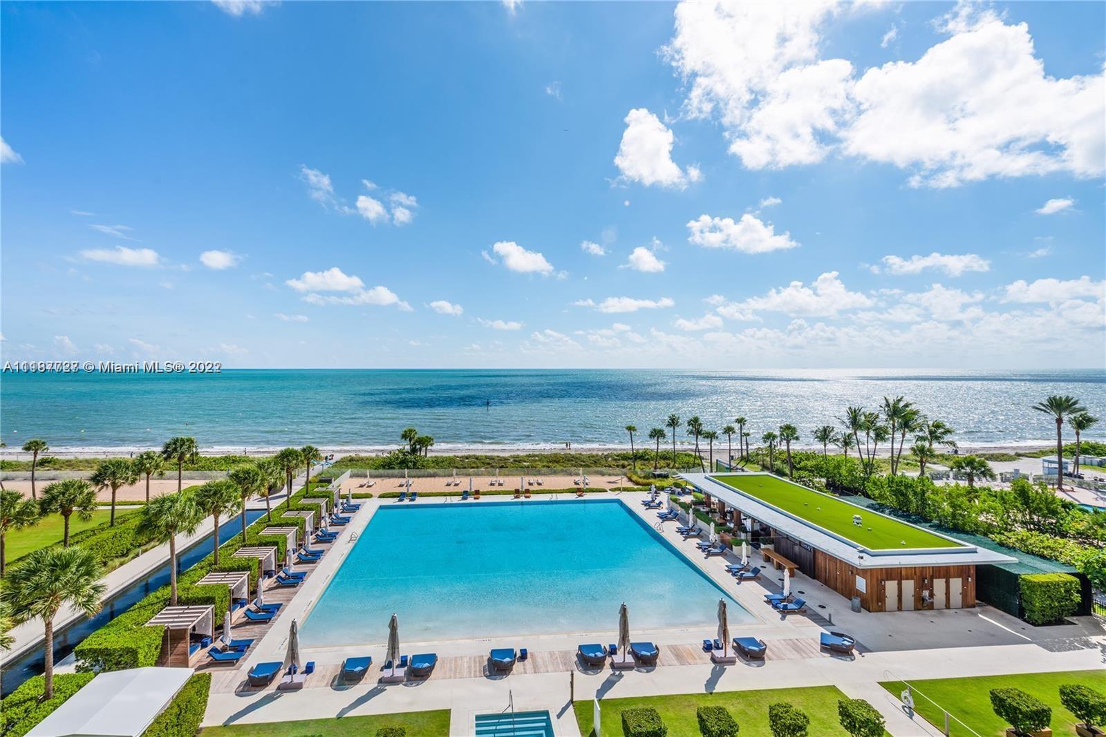 360 Ocean Drive, Unit 603S Key Biscayne, FL 33149 - Photo 9 of 29 a view of swimming pool with outdoor seating and city view