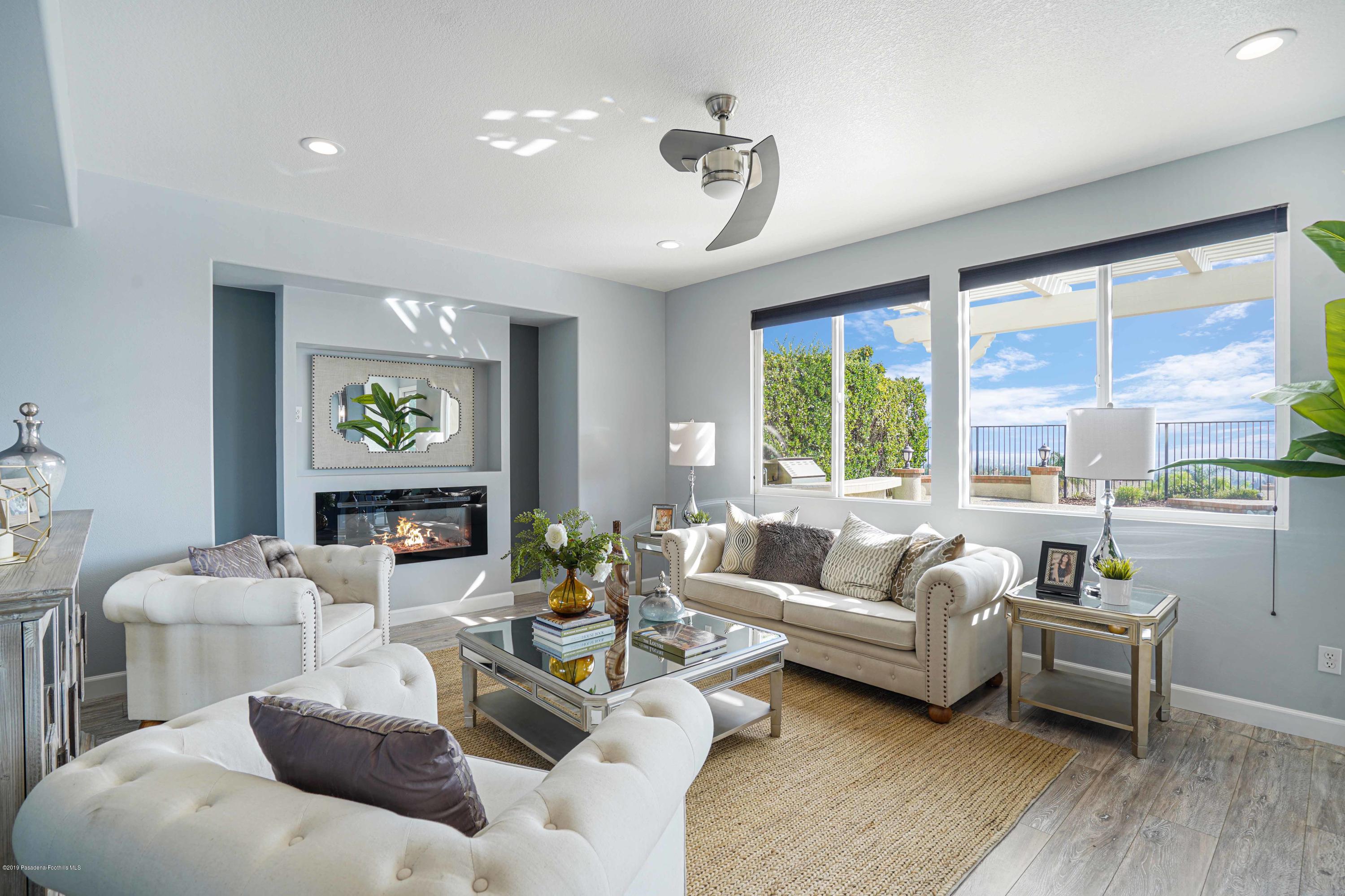 20548 Bergamo Way Porter Ranch, CA 91326 - Photo 12 of 58 a living room with furniture and a large window