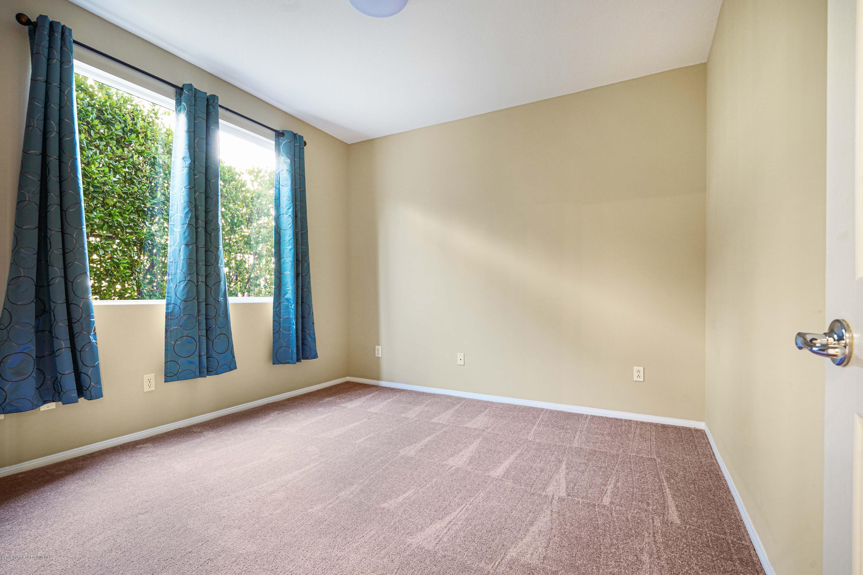 20548 Bergamo Way Porter Ranch, CA 91326 - Photo 23 of 58 a view of an empty room with a window