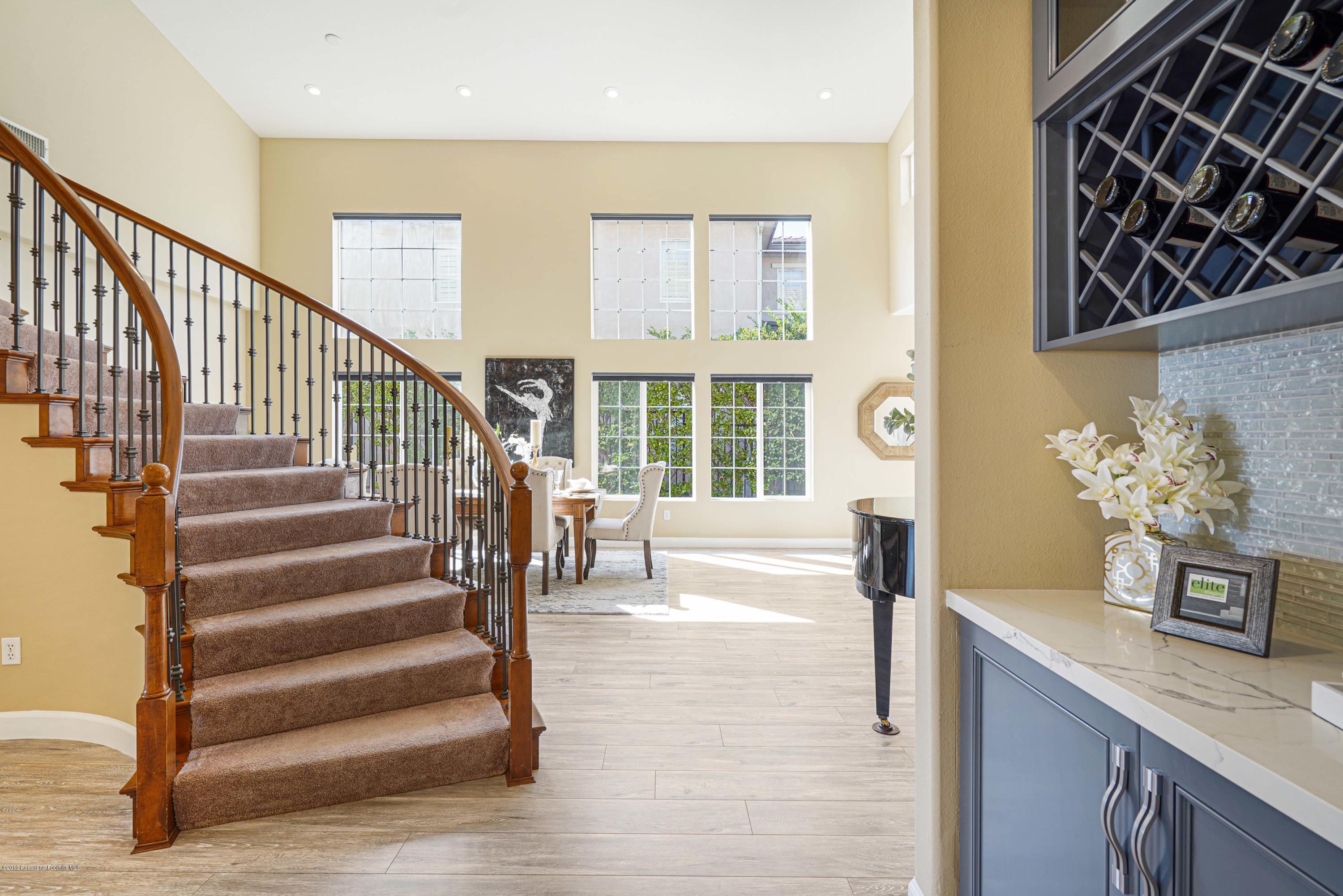 20548 Bergamo Way Porter Ranch, CA 91326 - Photo 24 of 58 a view of entryway kitchen and hall with wooden floor