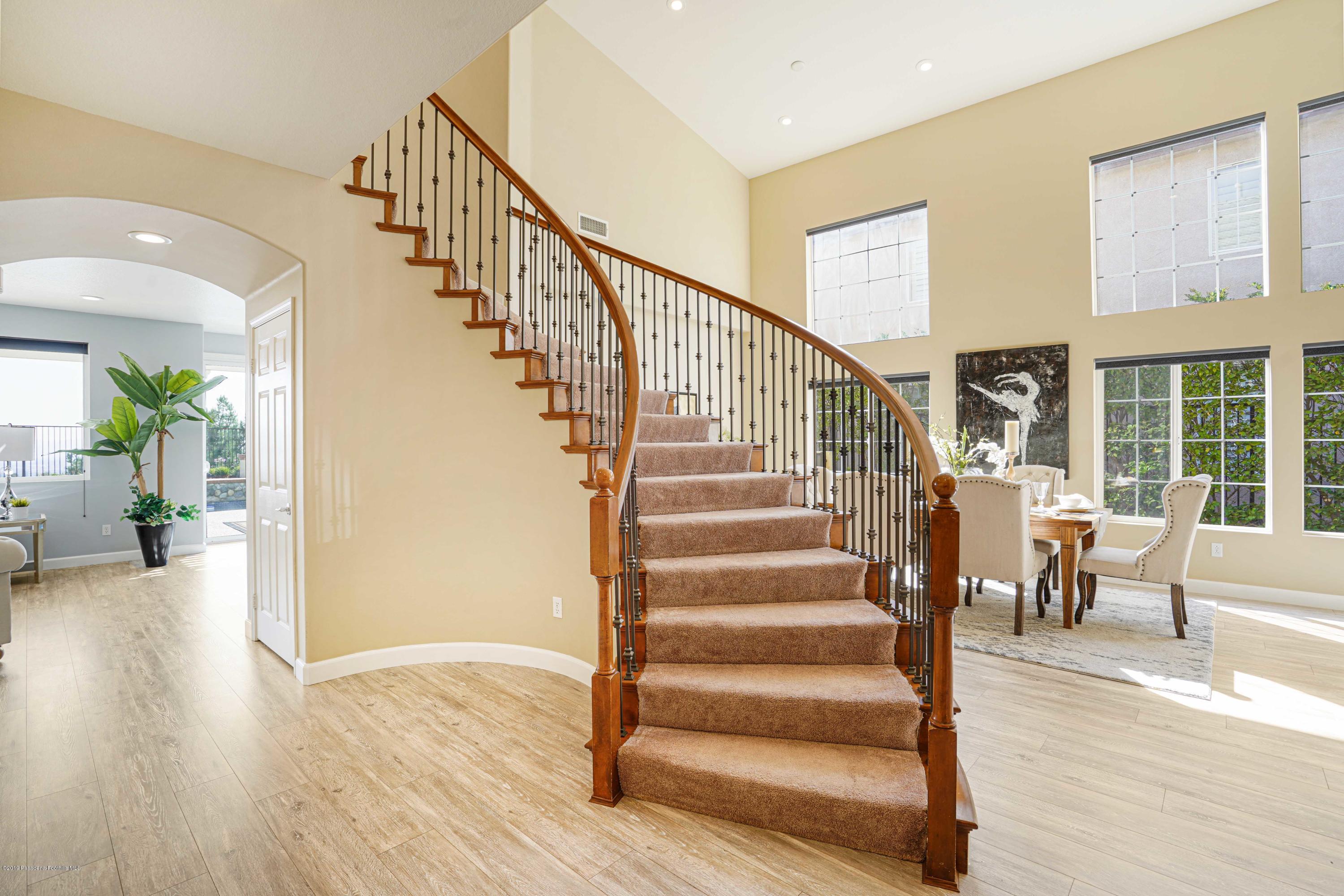 20548 Bergamo Way Porter Ranch, CA 91326 - Photo 25 of 58 a view of entryway and hall with wooden floor