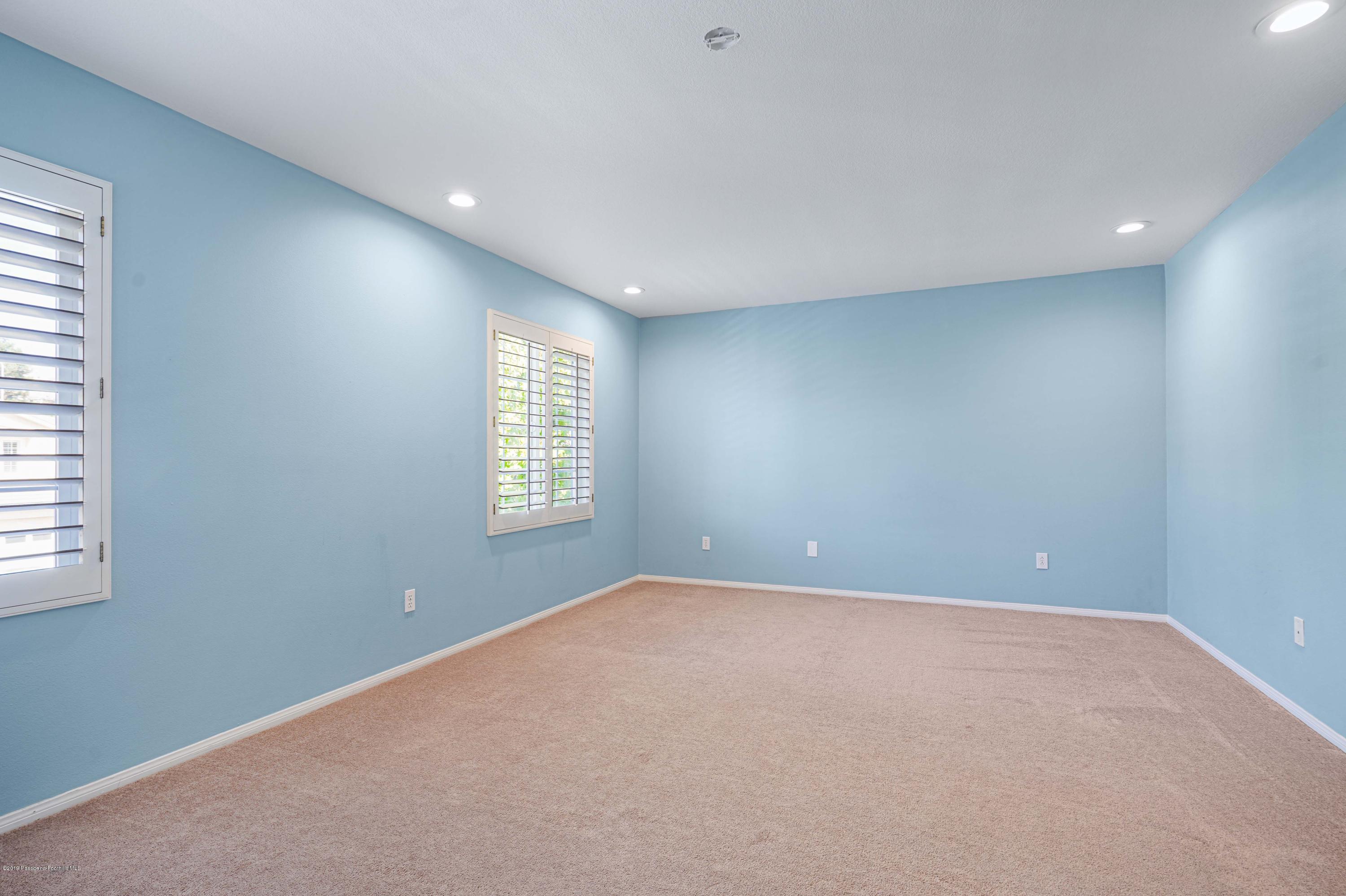20548 Bergamo Way Porter Ranch, CA 91326 - Photo 30 of 58 an empty room with windows