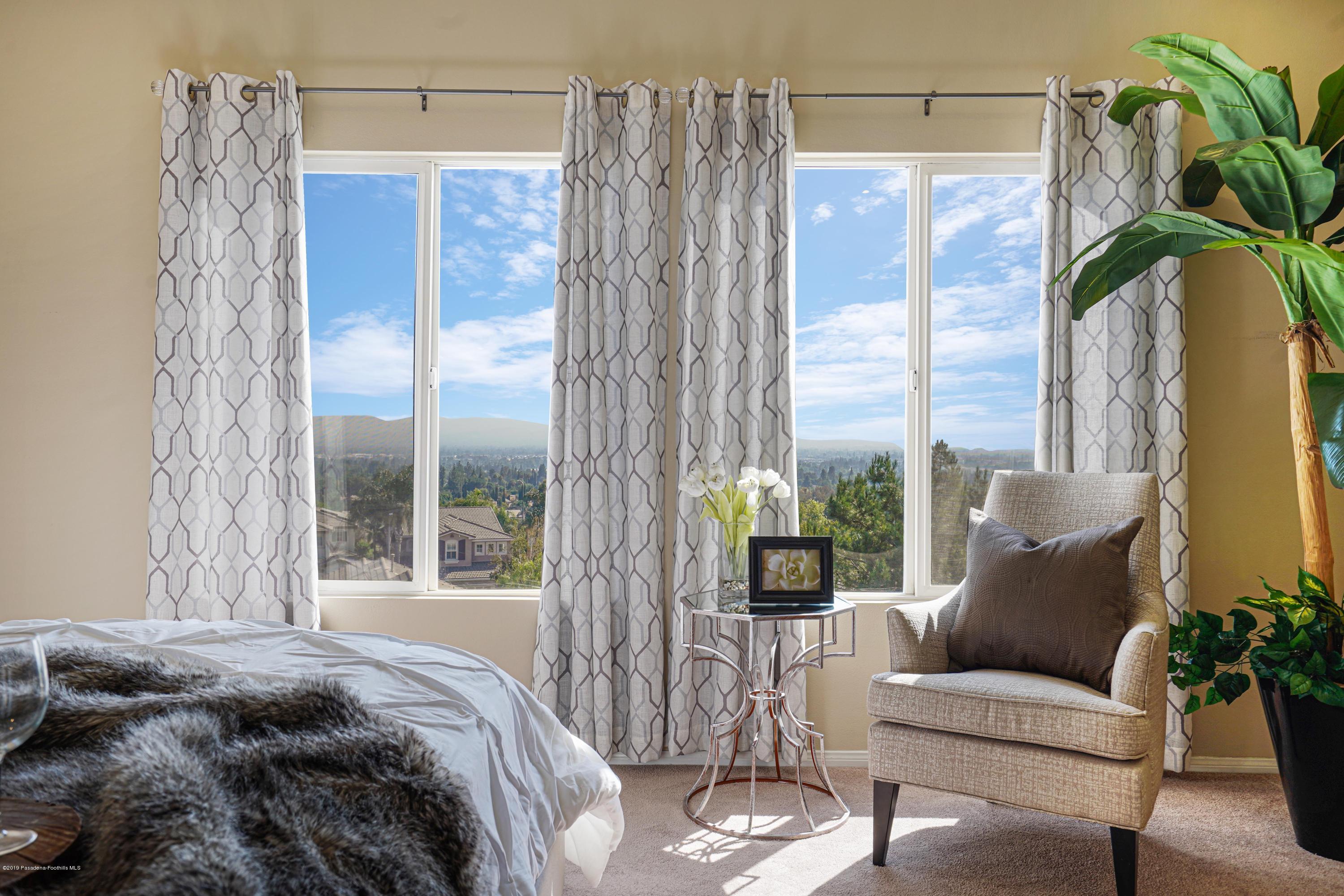 20548 Bergamo Way Porter Ranch, CA 91326 - Photo 34 of 58 a bedroom with a bed and a window
