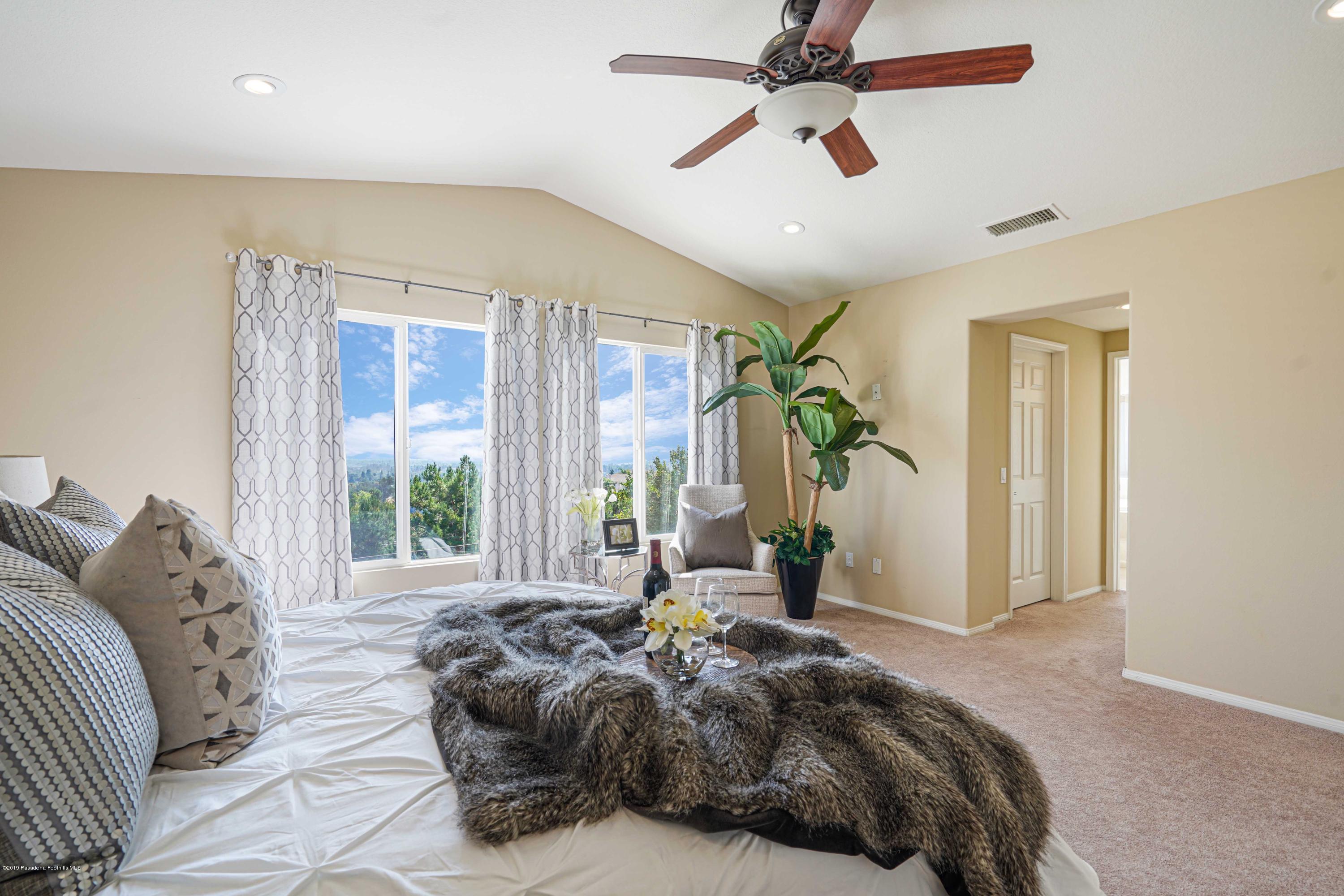 20548 Bergamo Way Porter Ranch, CA 91326 - Photo 35 of 58 a bed room with a bed and a window