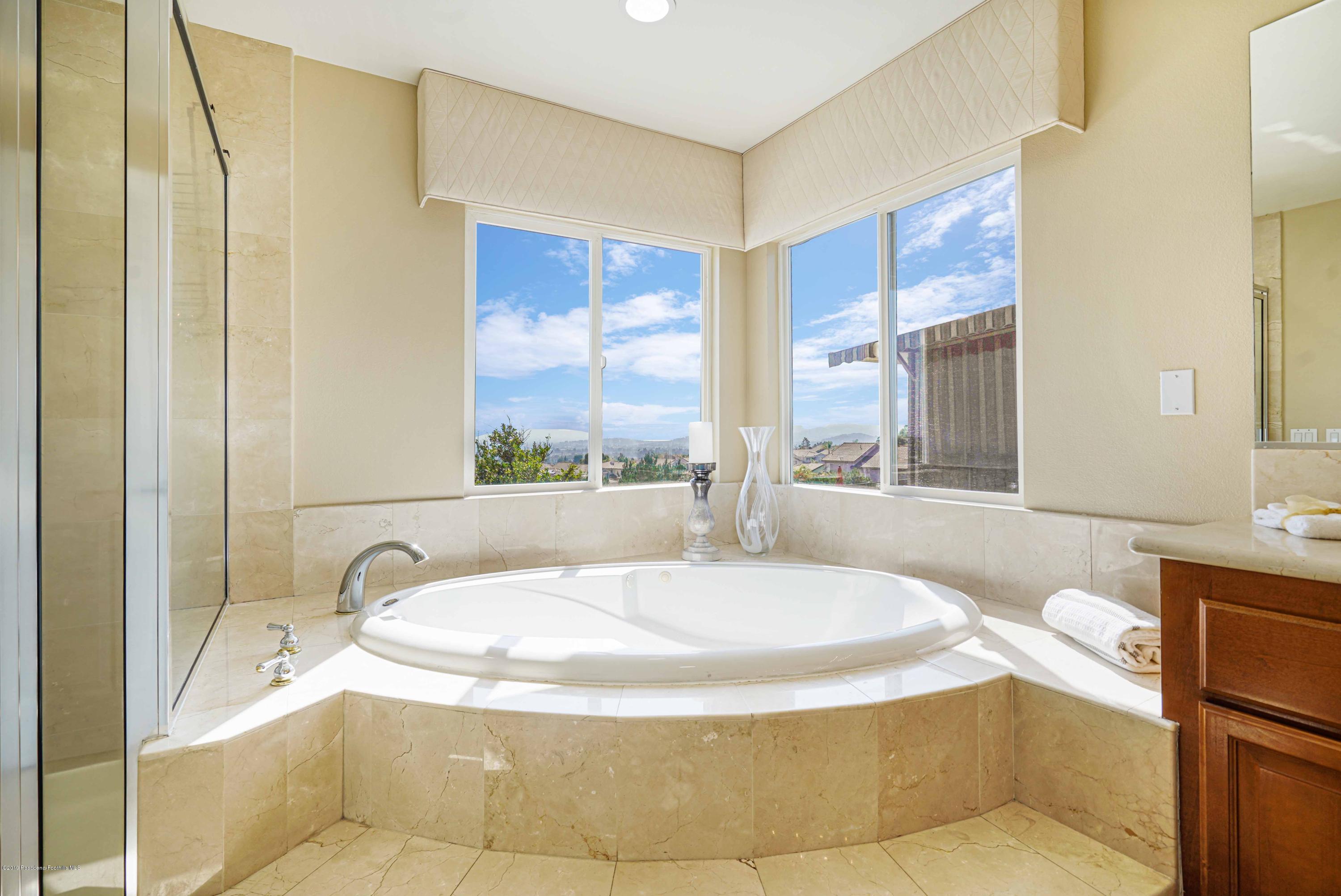 20548 Bergamo Way Porter Ranch, CA 91326 - Photo 42 of 58 a bathroom with a tub and sink