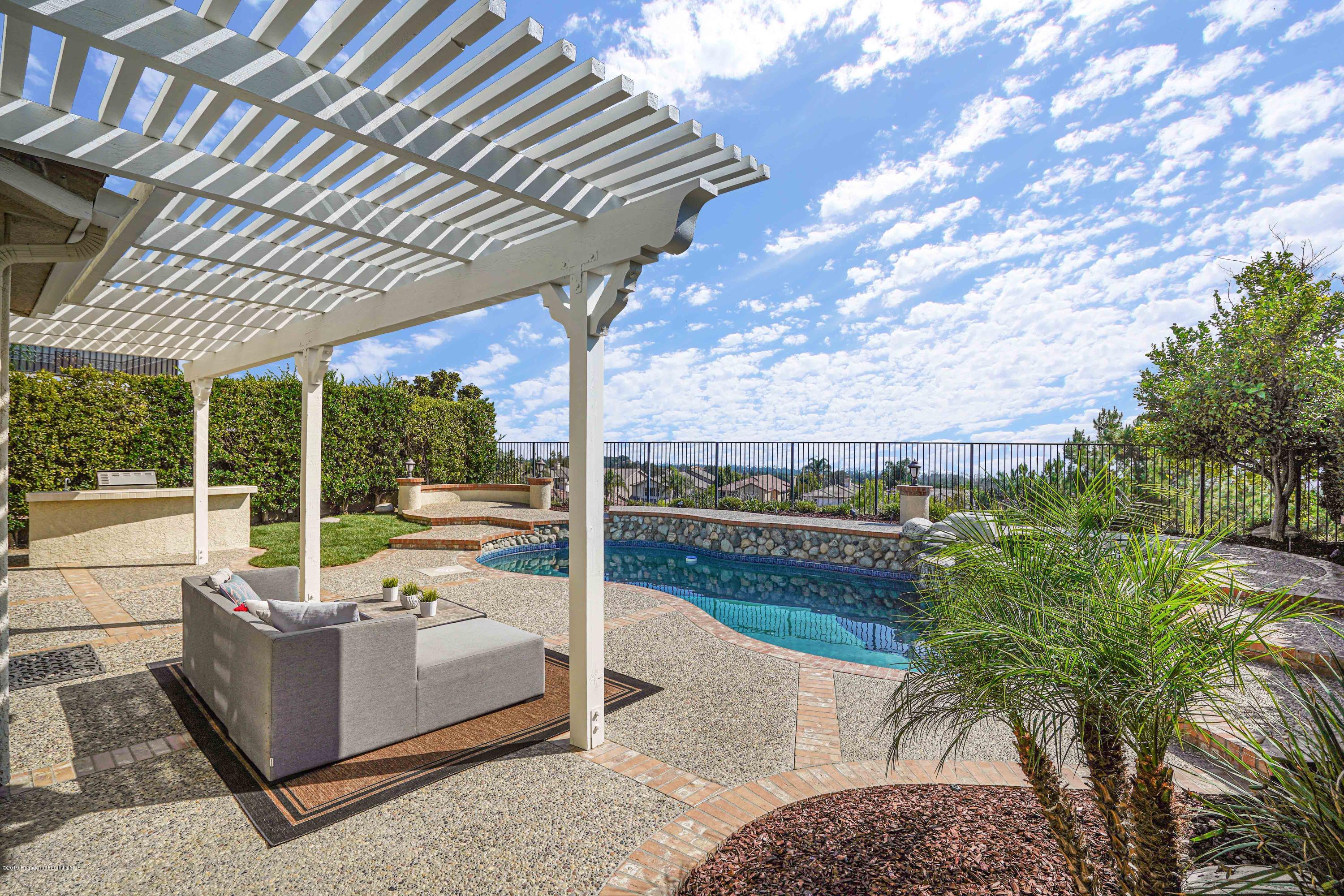 20548 Bergamo Way Porter Ranch, CA 91326 - Photo 48 of 58 a view of a couches in patio of the house