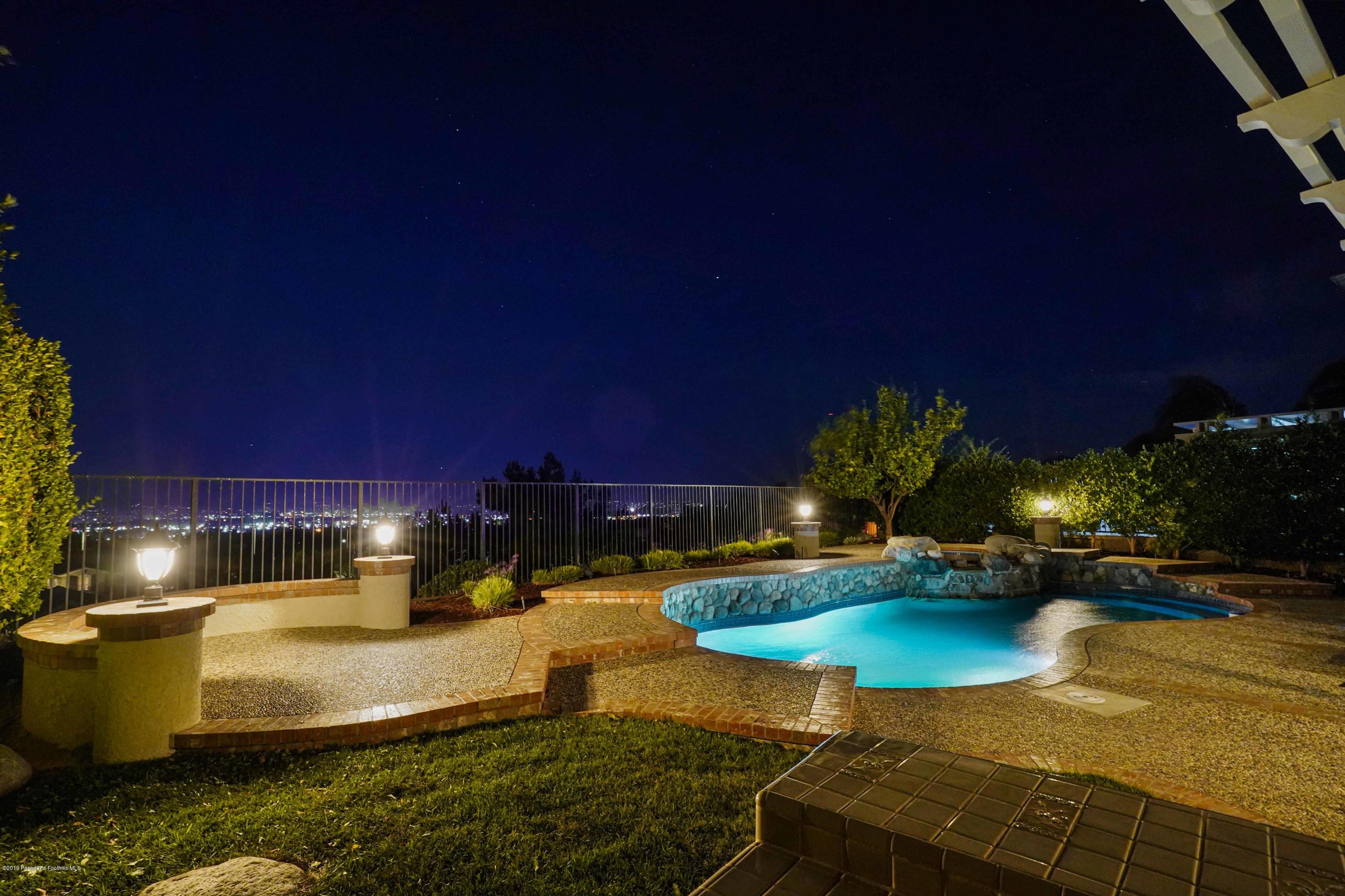 20548 Bergamo Way Porter Ranch, CA 91326 - Photo 53 of 58 a view of a backyard with swimming pool