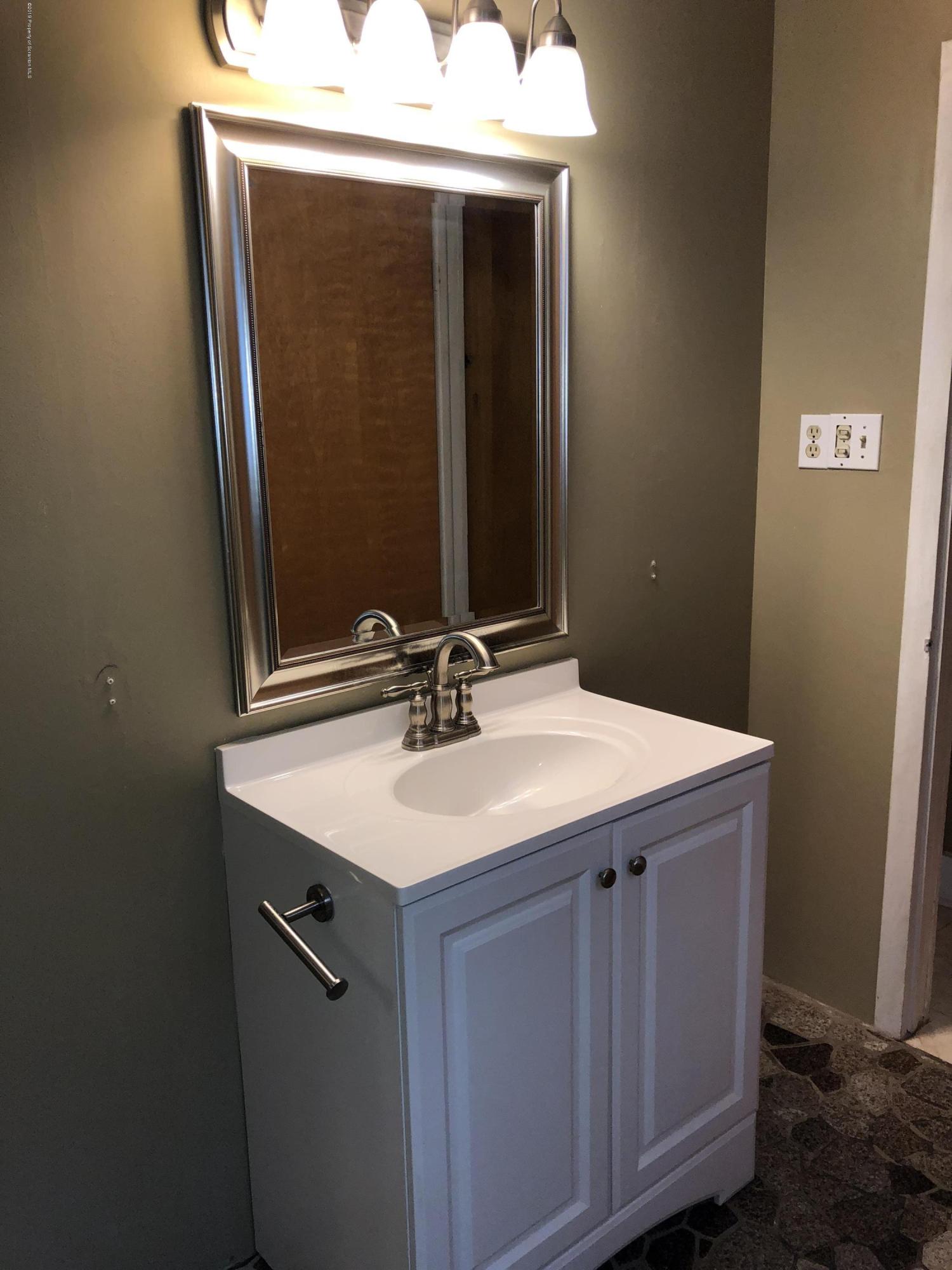 495 Cortez Road Lake Ariel, PA 18436 - Photo 14 of 39 a bathroom with a sink and a mirror