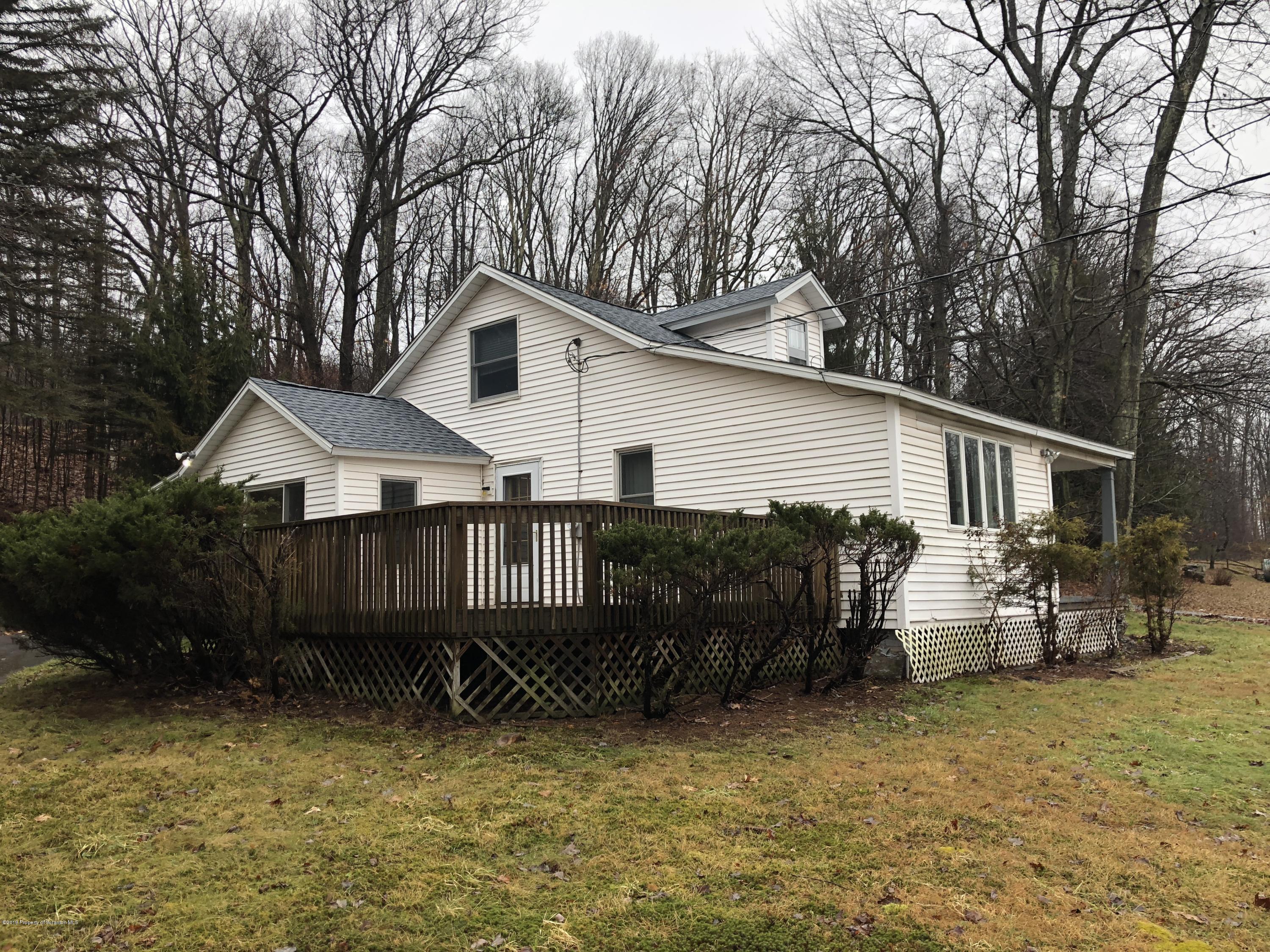 495 Cortez Road Lake Ariel, PA 18436 - Photo 2 of 39 a view of a house with backyard and sitting area