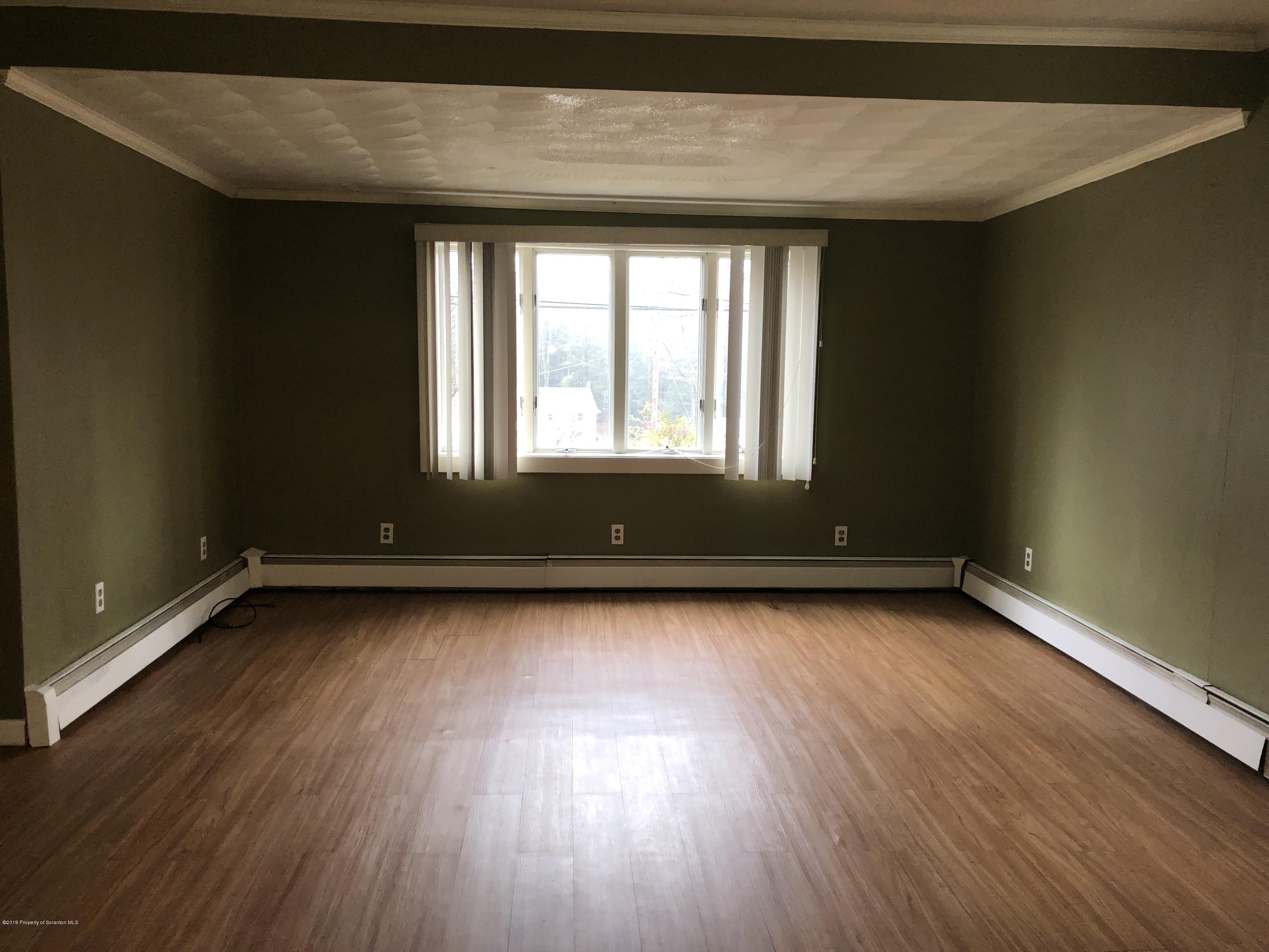 495 Cortez Road Lake Ariel, PA 18436 - Photo 6 of 39 a view of a room with wooden floors and window