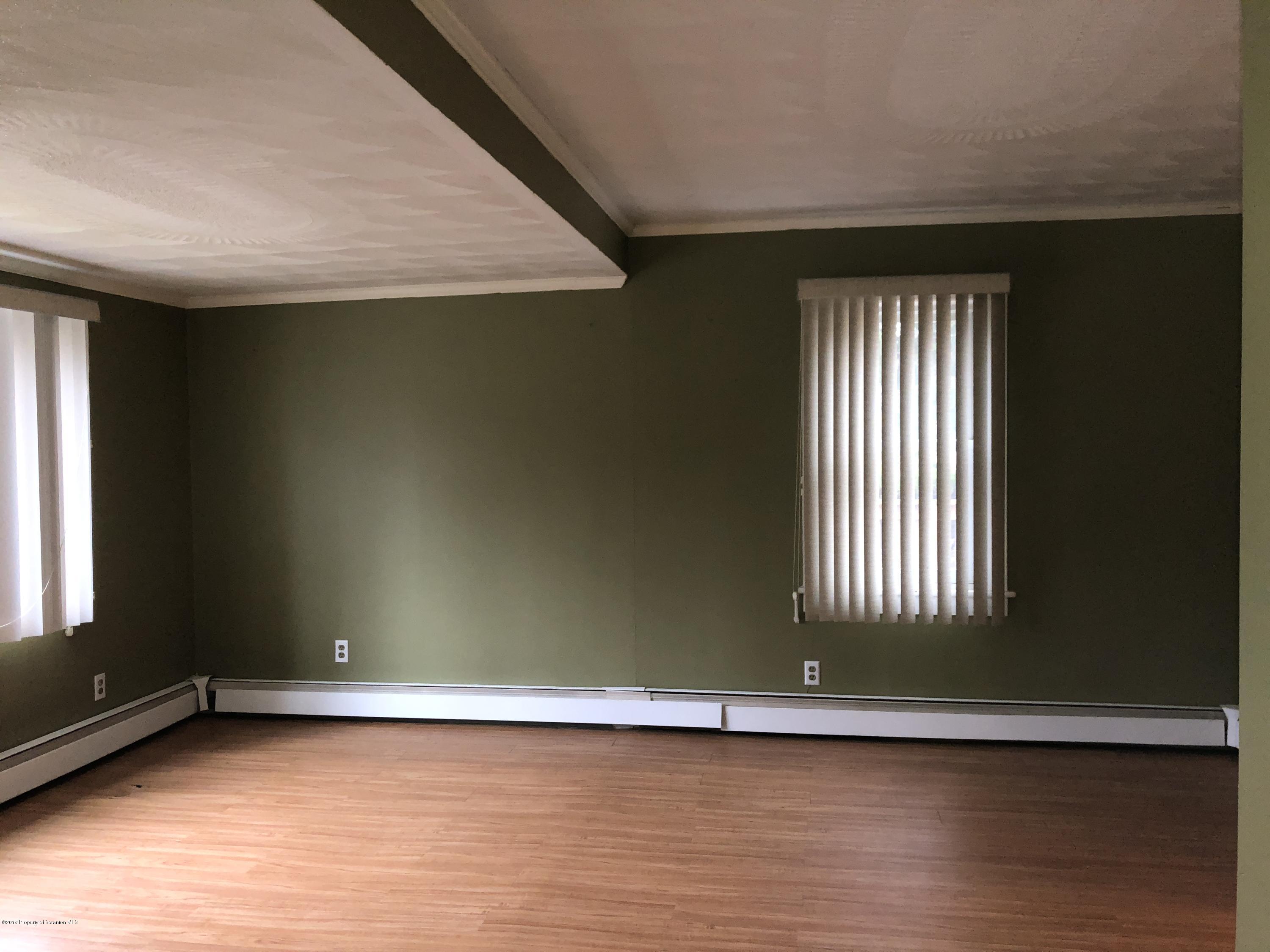 495 Cortez Road Lake Ariel, PA 18436 - Photo 7 of 39 an empty room with wooden floor and windows