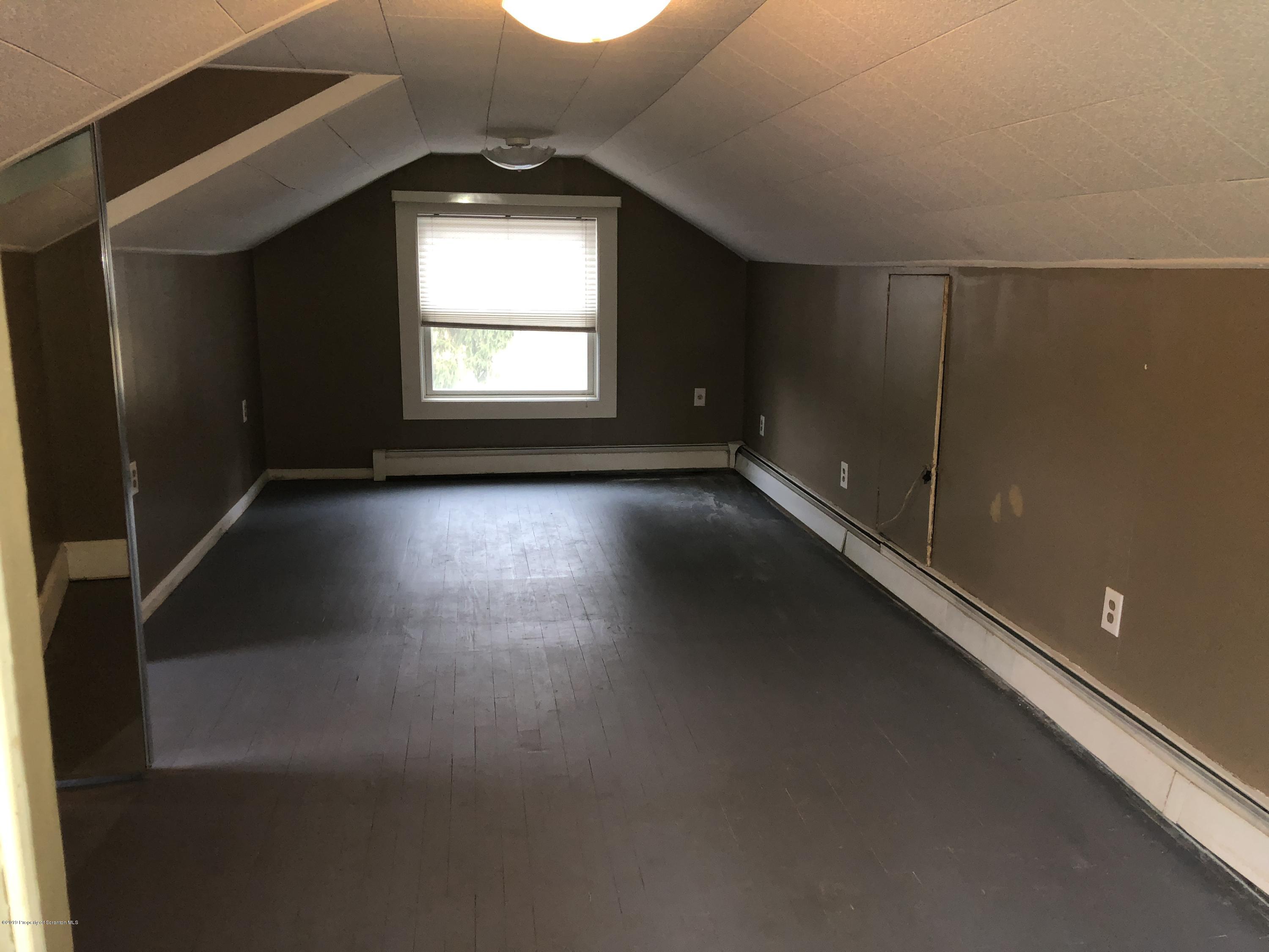 495 Cortez Road Lake Ariel, PA 18436 - Photo 10 of 39 an empty room with wooden floor and windows
