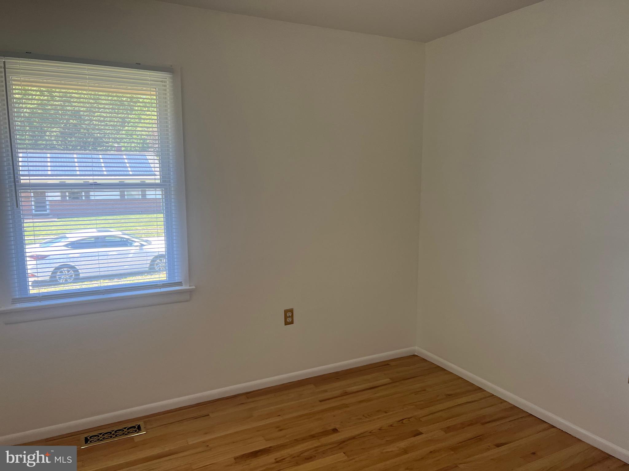 705 Bayberry Road Edgewood, MD 21040 - Photo 14 of 28 a view of an empty room with wooden floor and a window