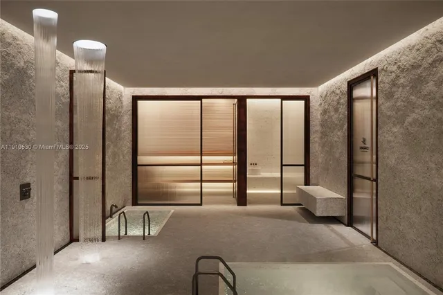 a bedroom with furniture and a large window