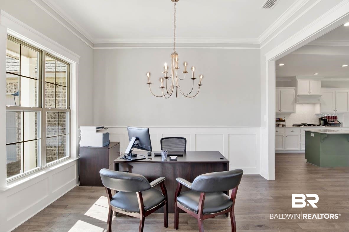 393 Garrison Boulevard Fairhope, AL 36532 - Photo 12 of 40 Dining room featuring crown molding, wood-type flooring, and a chandelier