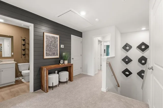 a view of work space with furniture and windows