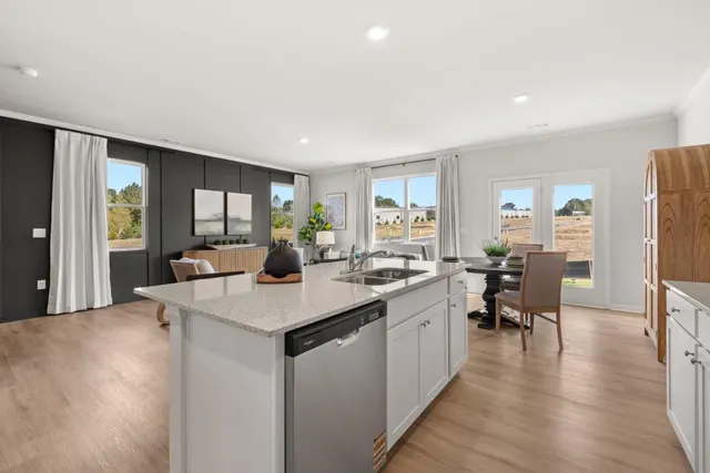 a open kitchen with sink cabinets and wooden floor