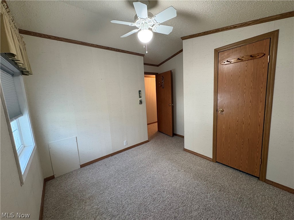 4455 Cleveland Road, Unit 20 Wooster, OH 44691 - Photo 32 of 38 Bedroom #2 with light carpet, ceiling fan, and crown molding