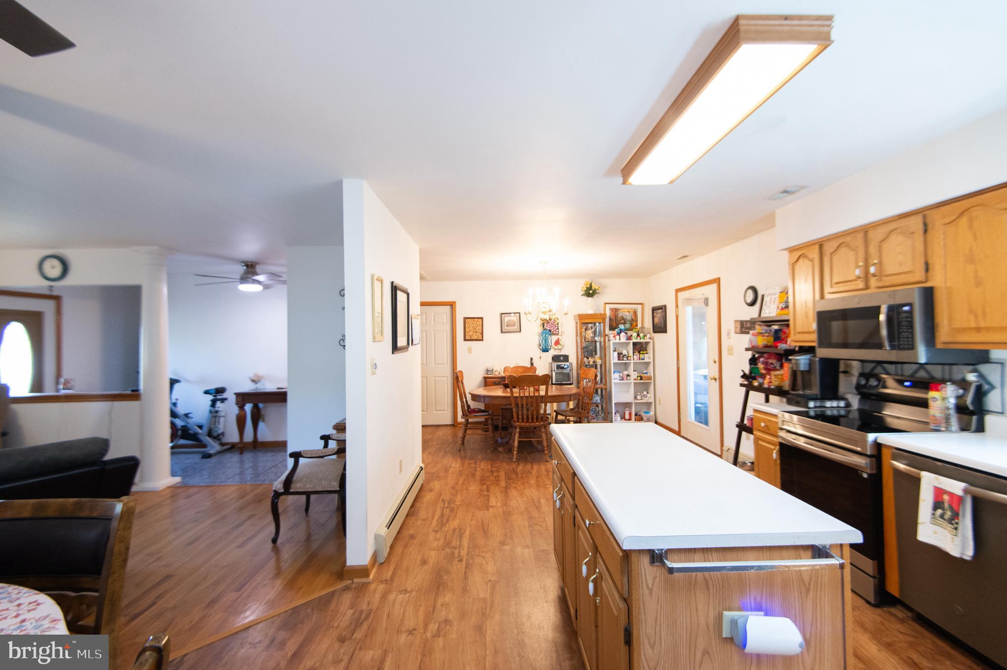 6010 Todds Point Road Cambridge, MD 21613 - Photo 13 of 52 a large kitchen with a table and chairs
