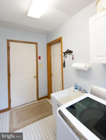 a kitchen with a cabinets and stove