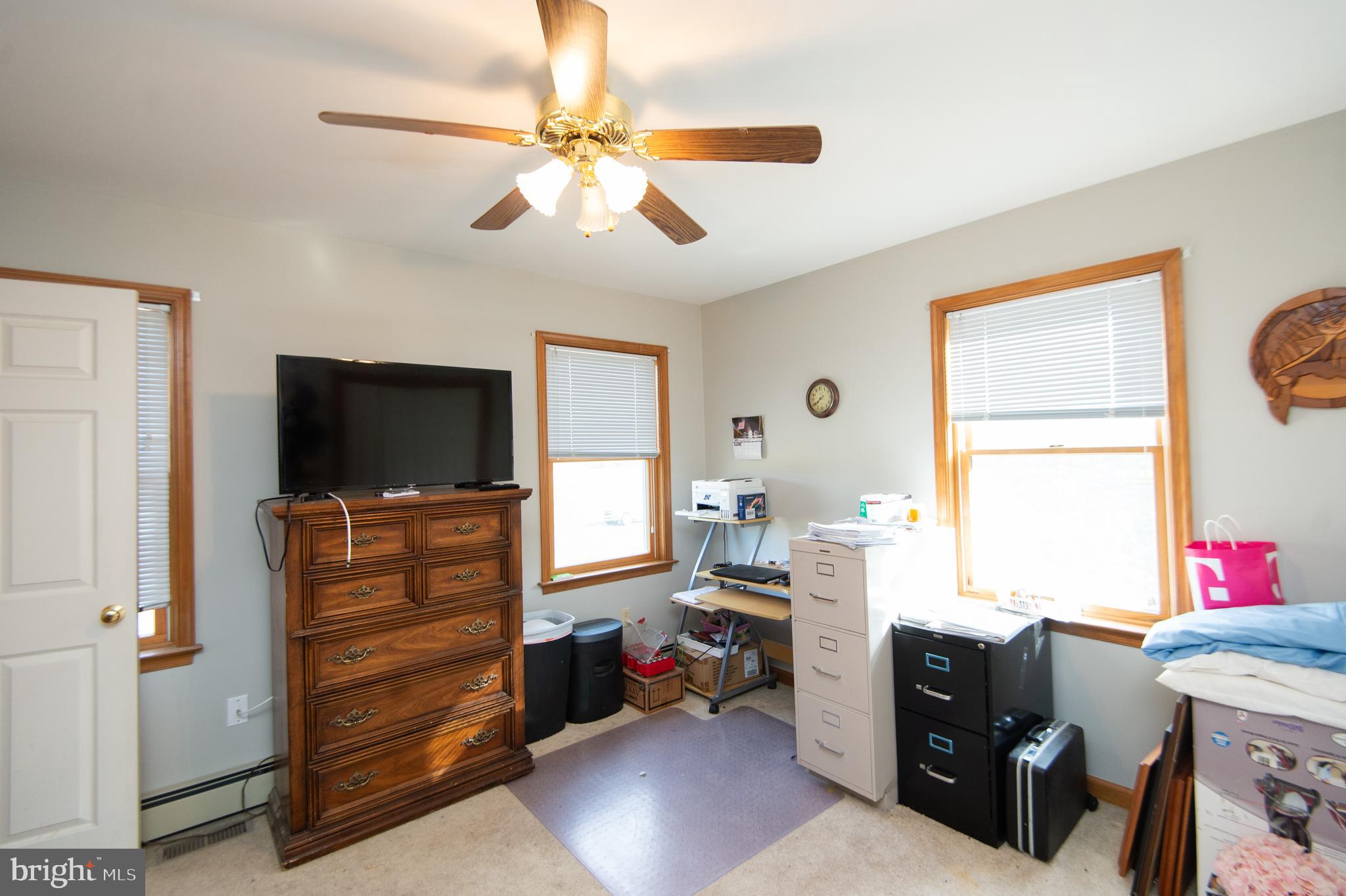 6010 Todds Point Road Cambridge, MD 21613 - Photo 31 of 52 a living room with furniture and a flat screen tv
