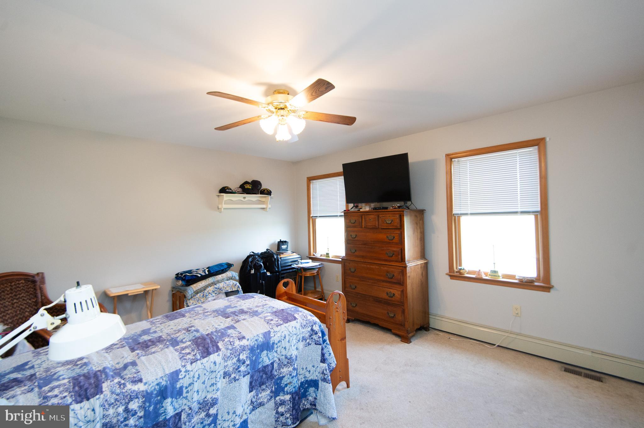 6010 Todds Point Road Cambridge, MD 21613 - Photo 37 of 52 a bedroom with a bed and a tv