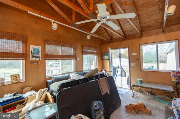 a view of a balcony with wooden floor
