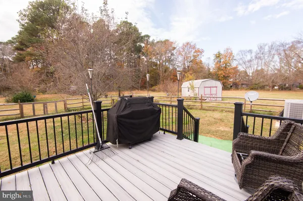 a view of a house with backyard and a slide