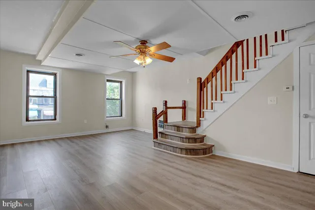 a view of an entryway with wooden floor