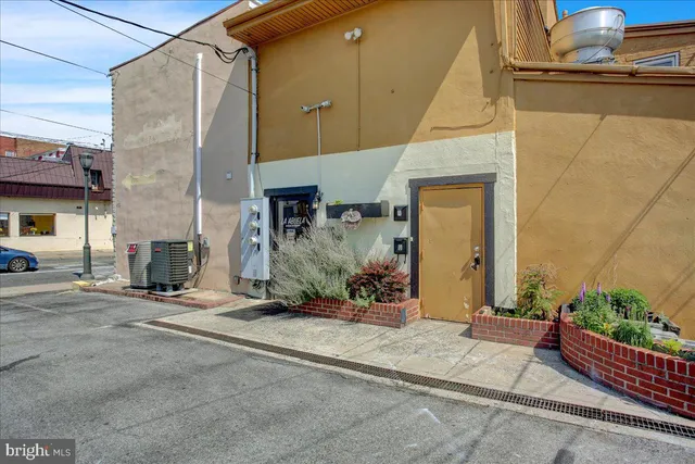 a front view of a house with basket ball court