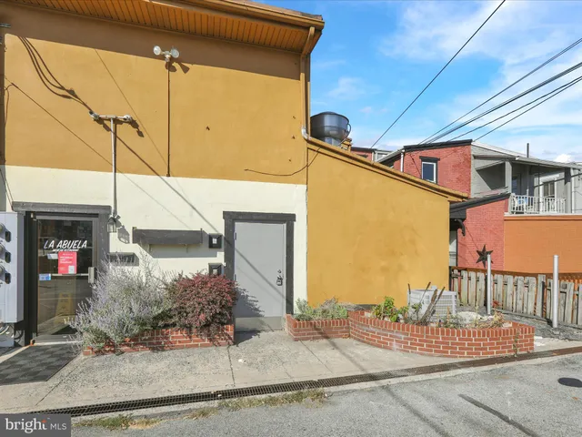 a front view of a house with entertaining space