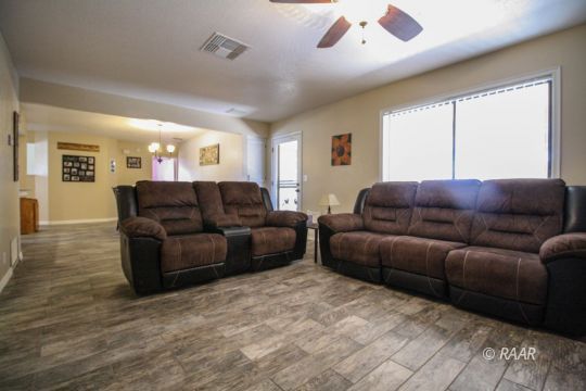 1124 Faith Court Ridgecrest, CA 93555 - Photo 14 of 35 a living room with furniture and a large window