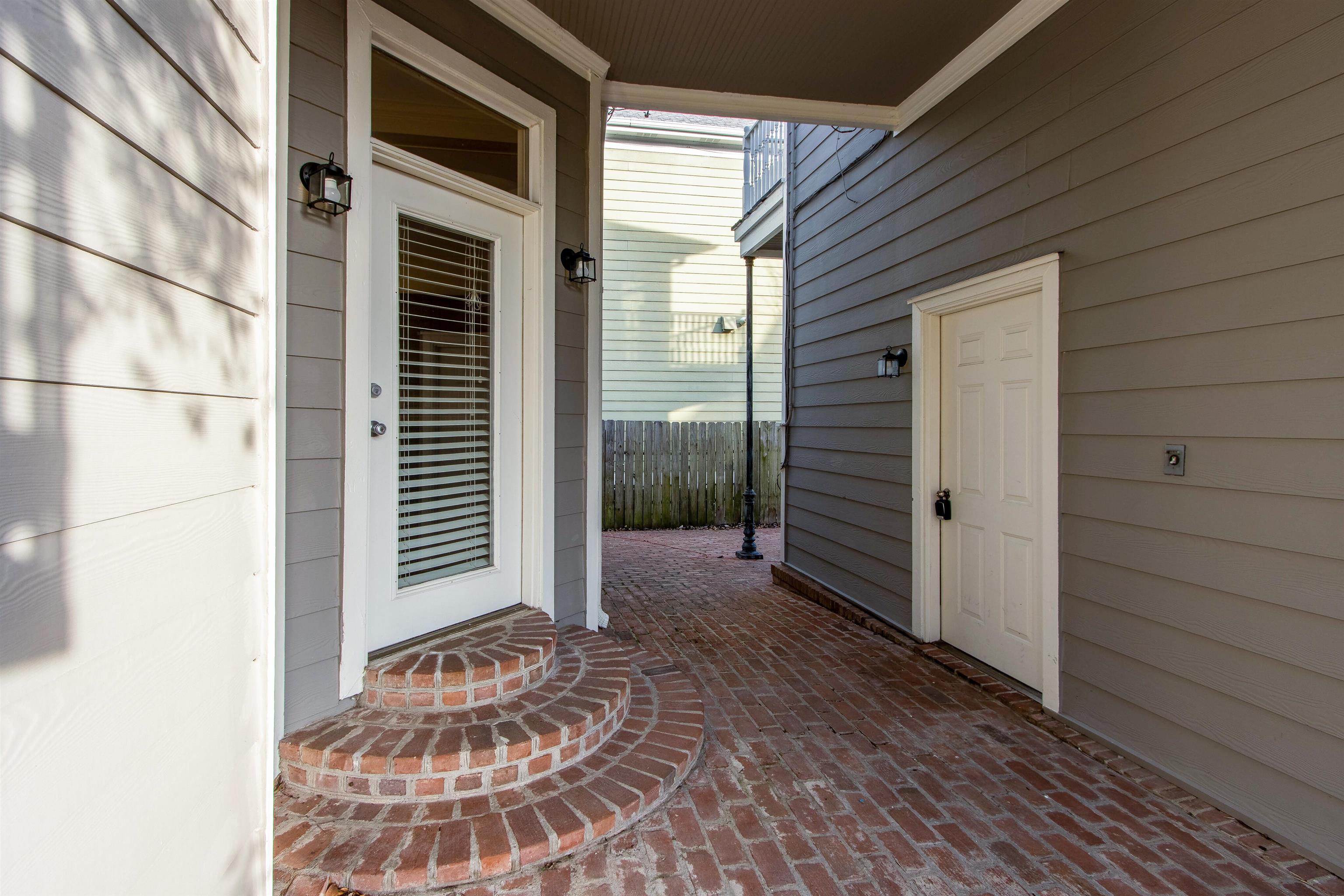 137 Harbor Point Lane, Unit STUDIO Memphis, TN 38103 - Photo 8 of 11 a view of a porch with a door and wooden floor
