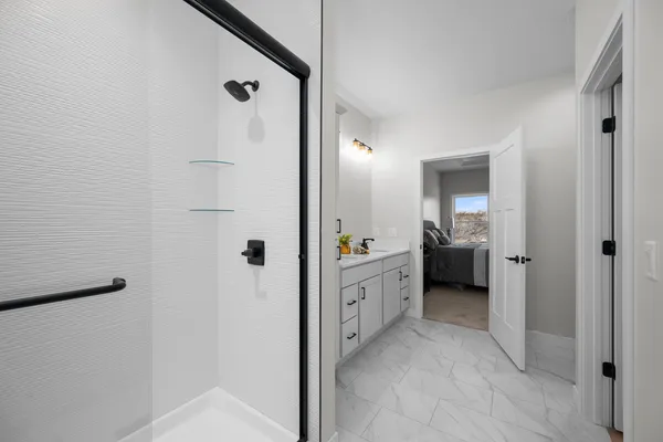 a view of a bathroom with a sink and mirror