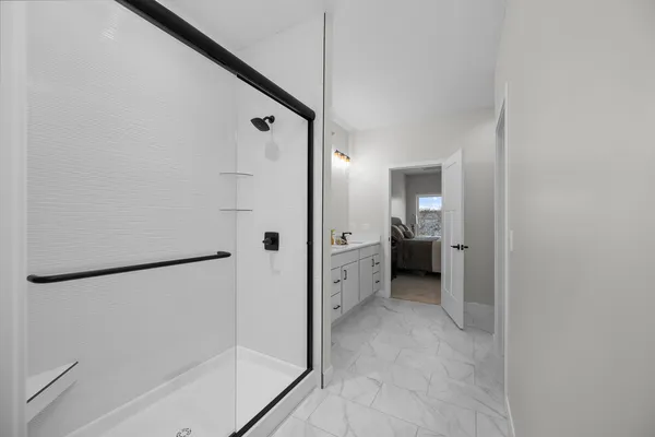 a bathroom with a double vanity sink and a mirror