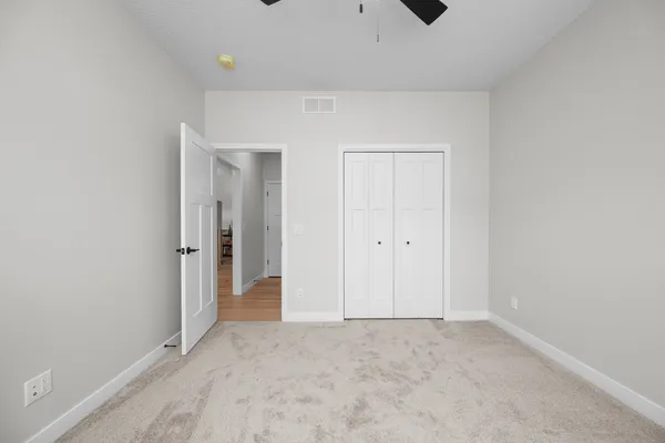 an empty room with a empty space and windows