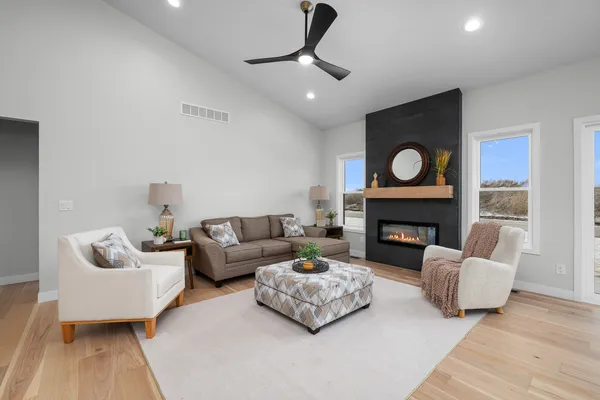 a living room with furniture and a fireplace