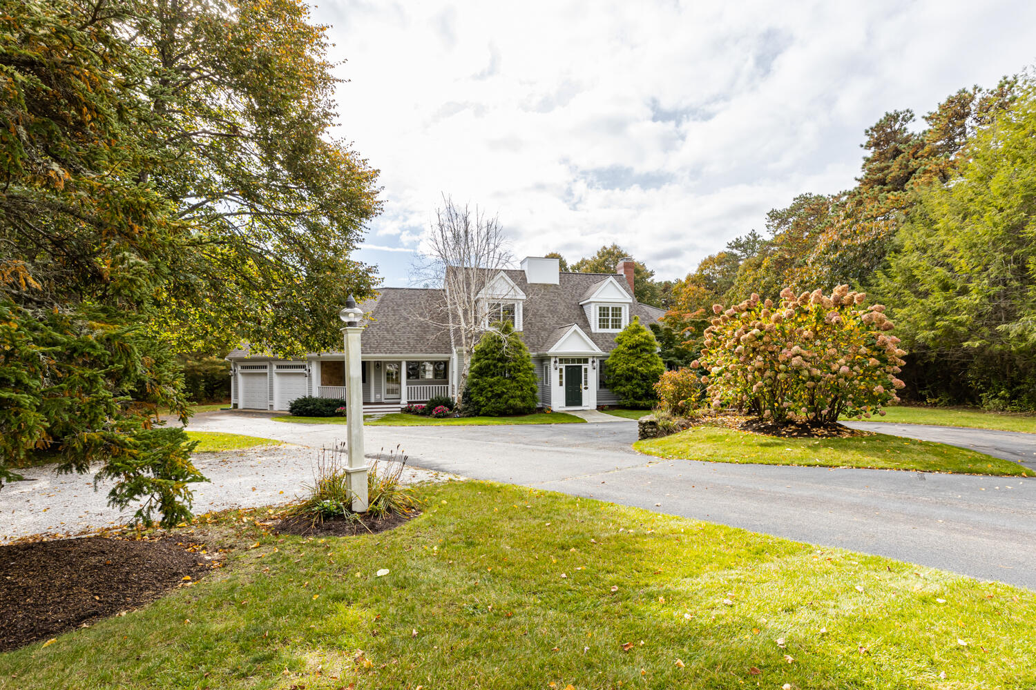 47 Farm Valley Road Osterville, MA 02655 - Photo 1 of 57 a view of a house with a big yard and large trees