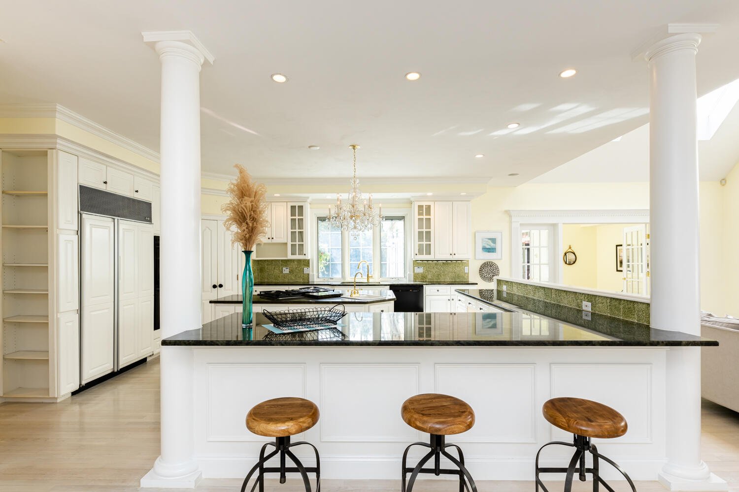 47 Farm Valley Road Osterville, MA 02655 - Photo 14 of 57 a kitchen with stainless steel appliances granite countertop a table chairs and a refrigerator